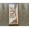 Giraffe nursery wall decor. A giraffe mother kisses a baby giraffe's head. The artwork is drawn using pyrography tools onto reclaimed wood.